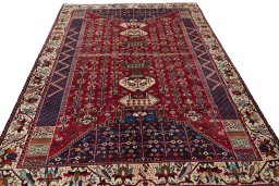 Surface texture of 2000s Shiraz rug with natural Wool and intricate pattern