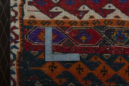 Backside of handmade 2000s Shiraz rug showing knot structure and weave density