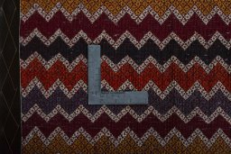Backside of handmade 2000s Shiraz rug showing knot structure and weave density