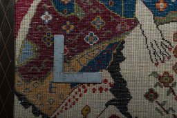 Backside of handmade 2000s Shiraz rug showing knot structure and weave density