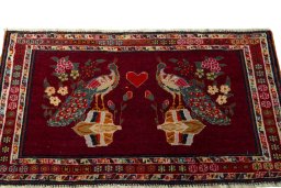 Surface texture of 2000s Shiraz rug with natural Wool and intricate pattern