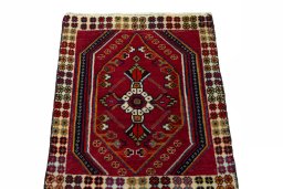 Surface texture of 2000s Shiraz rug with natural Wool and intricate pattern