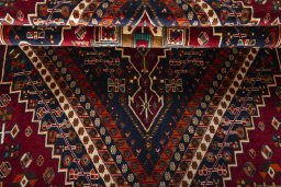 Corner detail of 2000s Shiraz rug showing border pattern and Wool pile