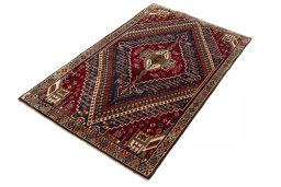 Corner detail of 2000s Shiraz rug showing border pattern and Wool pile