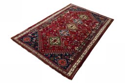 Corner detail of 2000s Shiraz rug showing border pattern and Wool pile