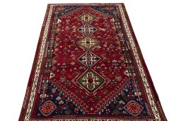Surface texture of 2000s Shiraz rug with natural Wool and intricate pattern