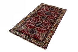 Corner detail of 2000s Shiraz rug showing border pattern and Wool pile