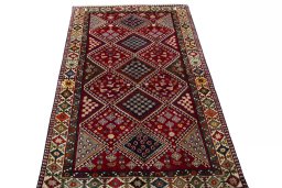 Surface texture of 2000s Shiraz rug with natural Wool and intricate pattern