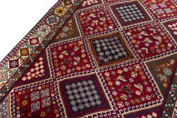 Backside of handmade 2000s Shiraz rug showing knot structure and weave density