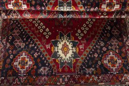 Corner detail of 2000s Shiraz rug showing border pattern and Wool pile