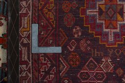 Surface texture of 2000s Shiraz rug with natural Wool and intricate pattern