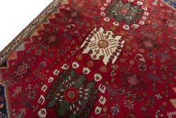 Backside of handmade 2000s Shiraz rug showing knot structure and weave density