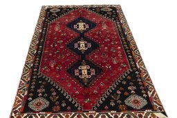 Surface texture of 2000s Shiraz rug with natural Wool and intricate pattern