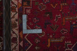Corner detail of 2000s Shiraz rug showing border pattern and Wool pile