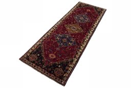 Corner detail of 2000s Shiraz rug showing border pattern and Wool pile