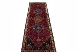 Surface texture of 2000s Shiraz rug with natural Wool and intricate pattern