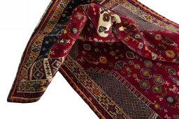 Corner detail of 2000s Shiraz rug showing border pattern and Wool pile