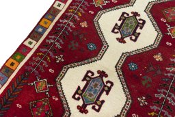 Backside of handmade 2000s Shiraz rug showing knot structure and weave density