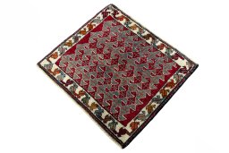 Corner detail of 2000s Shiraz rug showing border pattern and Wool pile
