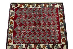 Surface texture of 2000s Shiraz rug with natural Wool and intricate pattern
