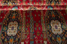 Corner detail of 2000s Shiraz rug showing border pattern and Wool pile