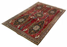 Corner detail of 2000s Shiraz rug showing border pattern and Wool pile