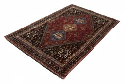 Corner detail of 2000s Shiraz rug showing border pattern and Wool pile
