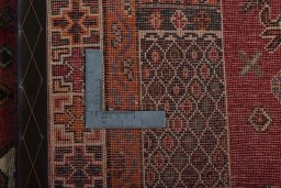 Backside of handmade 2000s Shiraz rug showing knot structure and weave density