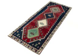 Corner detail of 2000s Shiraz rug showing border pattern and Wool pile