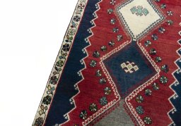 Backside of handmade 2000s Shiraz rug showing knot structure and weave density