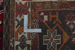 Surface texture of 2000s Shiraz rug with natural Wool and intricate pattern