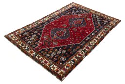 Corner detail of 2000s Shiraz rug showing border pattern and Wool pile