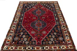 Surface texture of 2000s Shiraz rug with natural Wool and intricate pattern