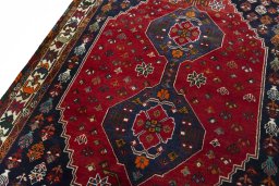 Backside of handmade 2000s Shiraz rug showing knot structure and weave density