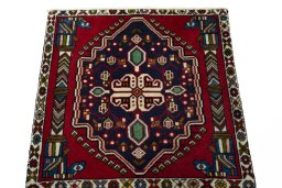 Surface texture of 2000s Shiraz rug with natural Wool and intricate pattern