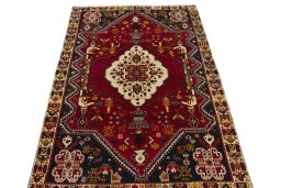 Surface texture of 2000s Shiraz rug with natural Wool and intricate pattern