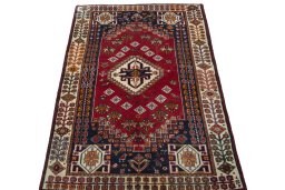 Surface texture of 2000s Shiraz rug with natural Wool and intricate pattern