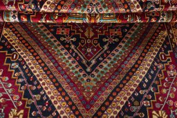Corner detail of 2000s Shiraz rug showing border pattern and Wool pile