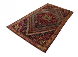 Corner detail of 2000s Shiraz rug showing border pattern and Wool pile