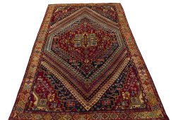 Surface texture of 2000s Shiraz rug with natural Wool and intricate pattern