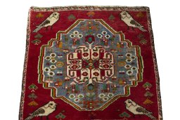 Surface texture of 2000s Shiraz rug with natural Wool and intricate pattern