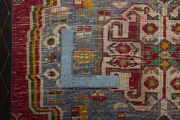 Backside of handmade 2000s Shiraz rug showing knot structure and weave density