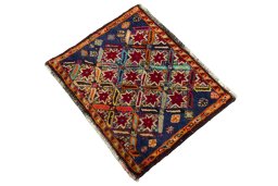 Corner detail of 2000s Shiraz rug showing border pattern and Wool pile