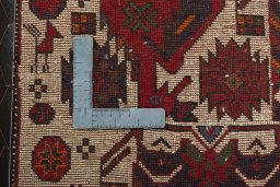 Backside of handmade 2000s Shiraz rug showing knot structure and weave density