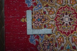 Backside of handmade 2000s Shiraz rug showing knot structure and weave density