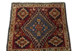 Surface texture of 2000s Shiraz rug with natural Wool and intricate pattern