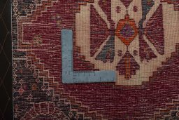 Backside of handmade 2000s Shiraz rug showing knot structure and weave density