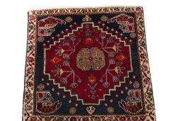 Surface texture of 2000s Shiraz rug with natural Wool and intricate pattern
