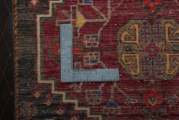 Backside of handmade 2000s Shiraz rug showing knot structure and weave density