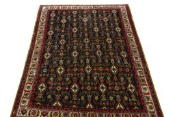 Surface texture of 2000s Shiraz rug with natural Wool and intricate pattern